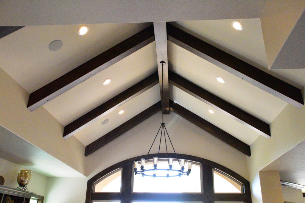 Brown arches with a hanging chandelier